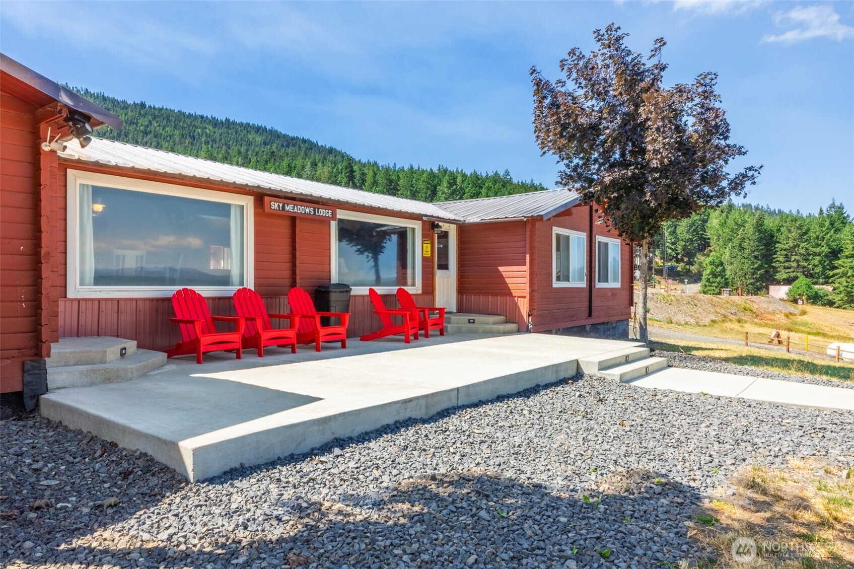 451 Aspen Springs Road Cle Elum, WA 98922 - Photo 29 of 31 a view of a house with backyard and sitting area