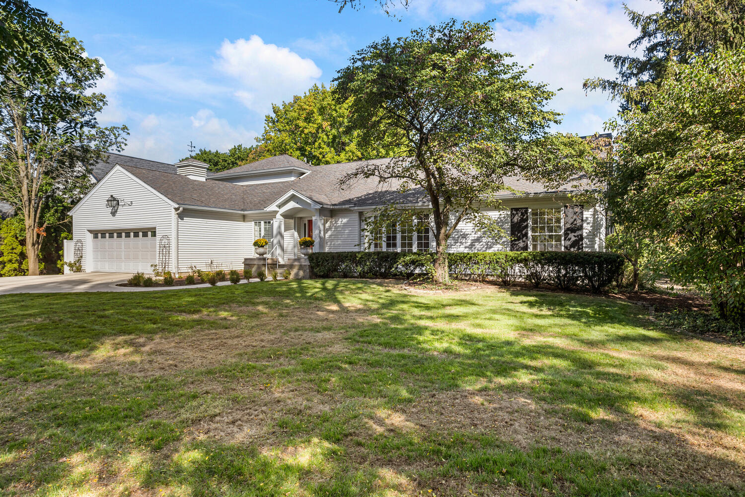 7 Greencroft Drive Champaign, IL 61821 - Photo 2 of 45 a front view of a house with a garden
