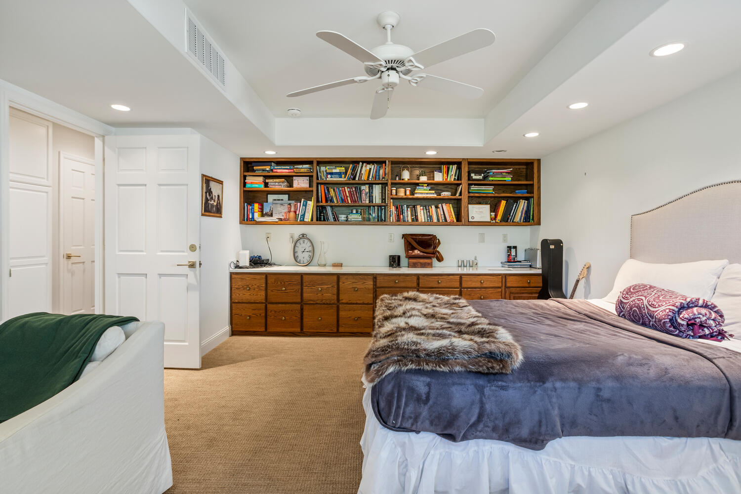 7 Greencroft Drive Champaign, IL 61821 - Photo 28 of 45 a bedroom with a large bed and a book shelf