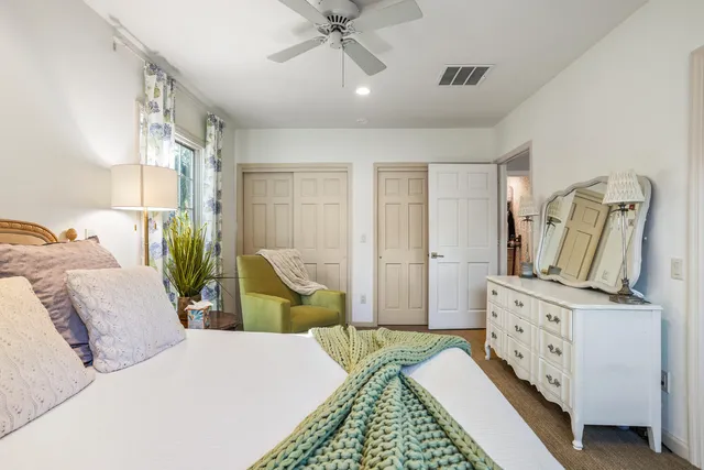 a bathroom with a sink vanity mirror and a bathtub