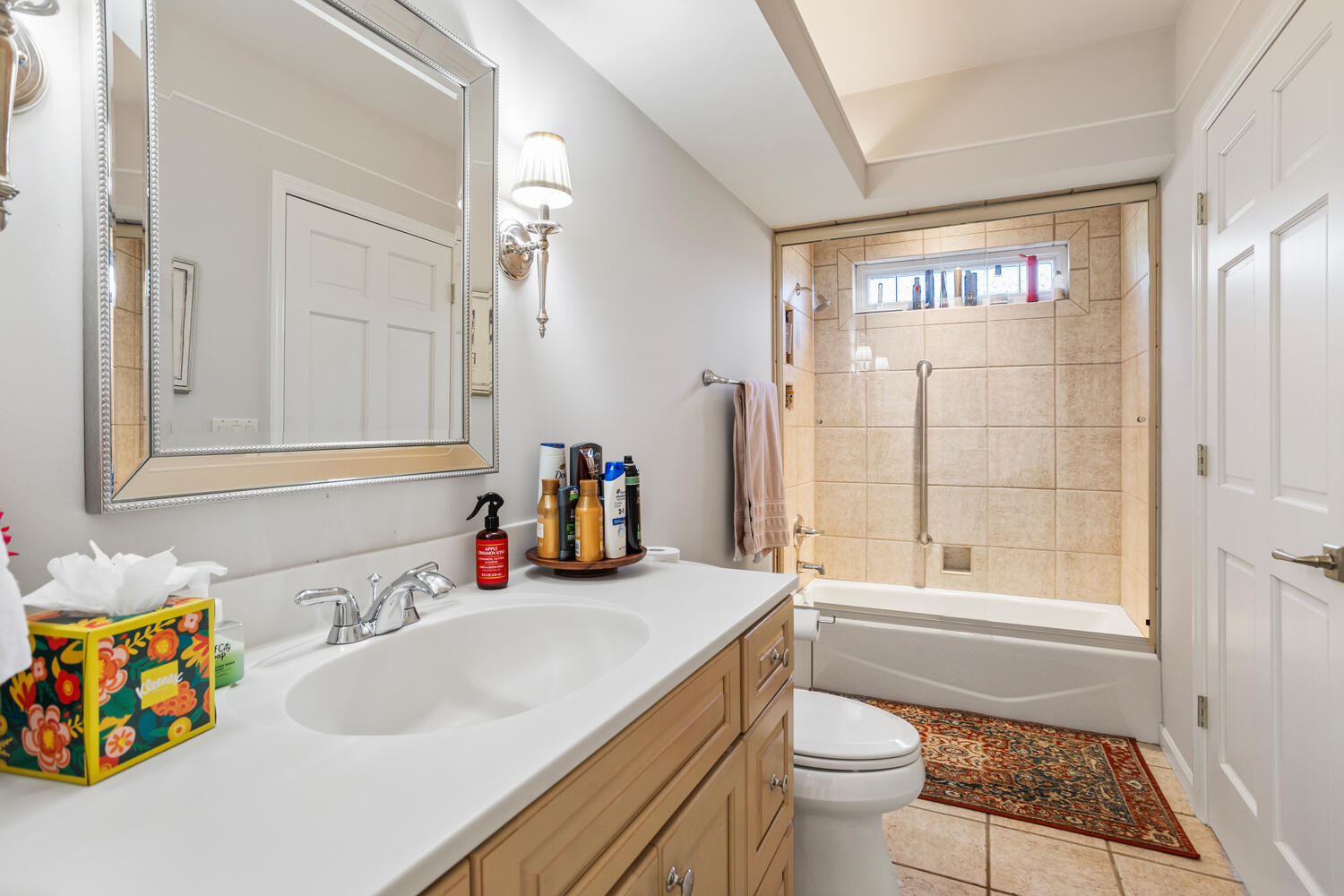 7 Greencroft Drive Champaign, IL 61821 - Photo 31 of 45 a bathroom with a sink vanity mirror and a bathtub