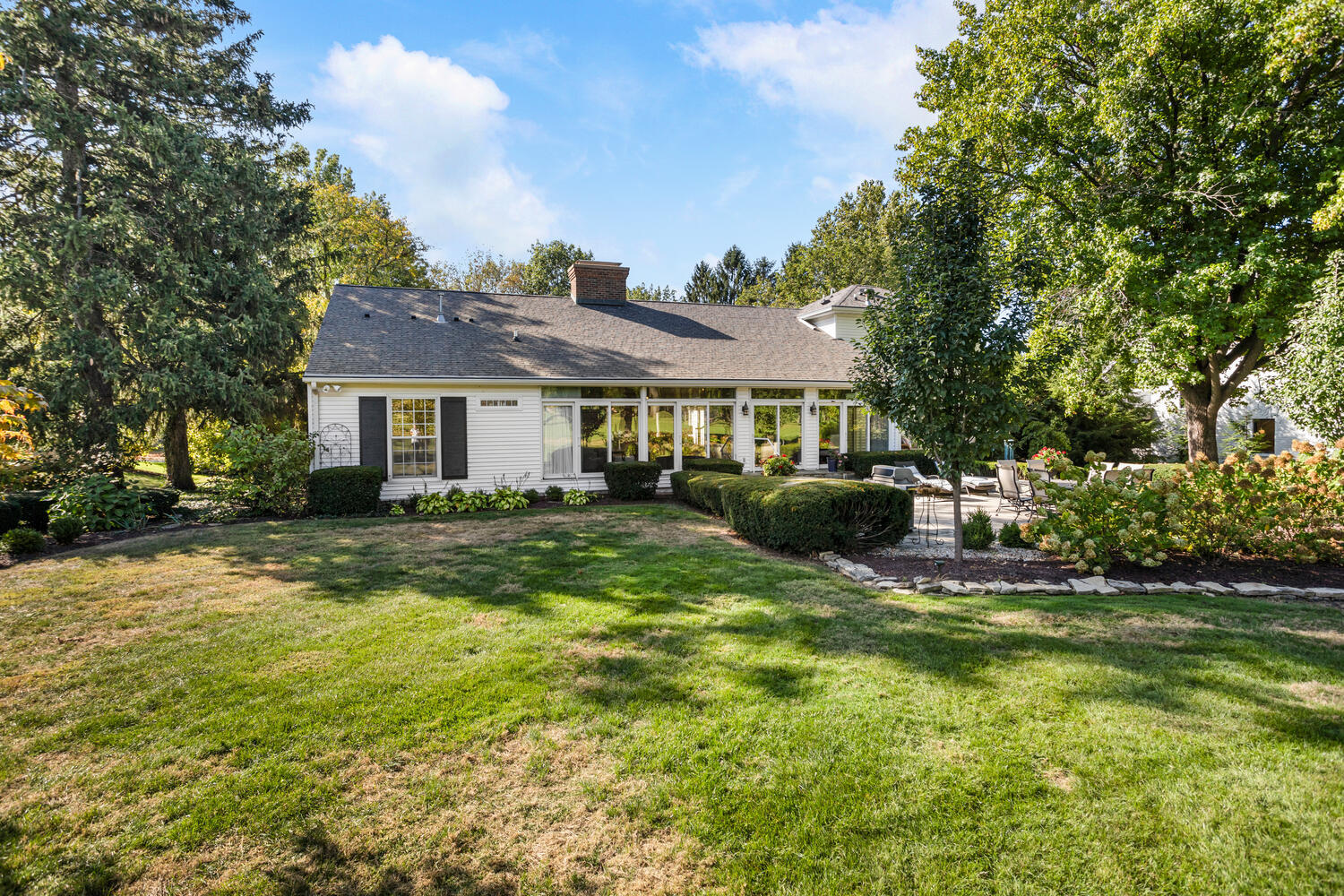 7 Greencroft Drive Champaign, IL 61821 - Photo 36 of 45 a view of a house with a big yard potted plants and large tree