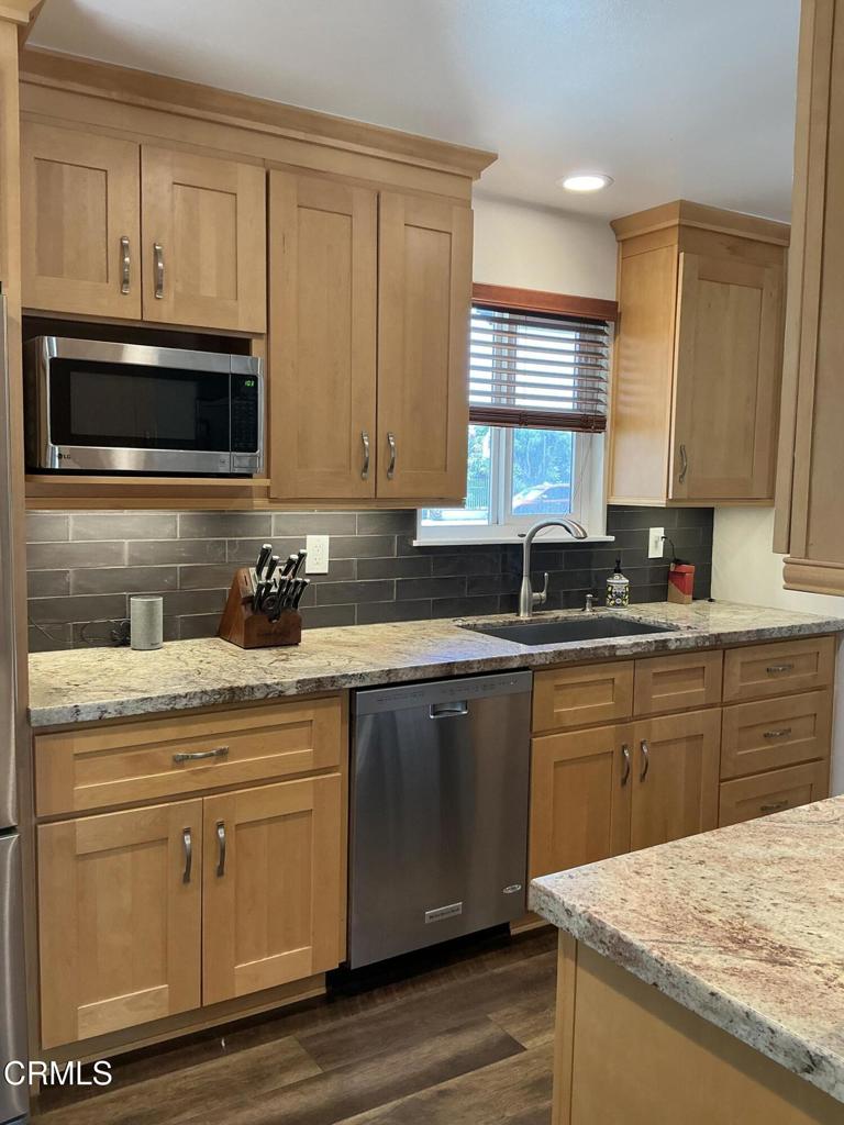 285 2nd Street Moorpark, CA 93021 - Photo 3 of 35 a kitchen with granite countertop cabinets stainless steel appliances and a sink