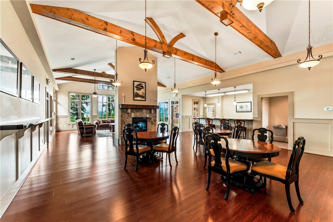 110 Gabriel Way Pickens, SC 29671 - Photo 44 of 48 Community Center. Hardwood floors stretch across this elegant common area, complete with a stone fireplace and exposed ceiling beams.