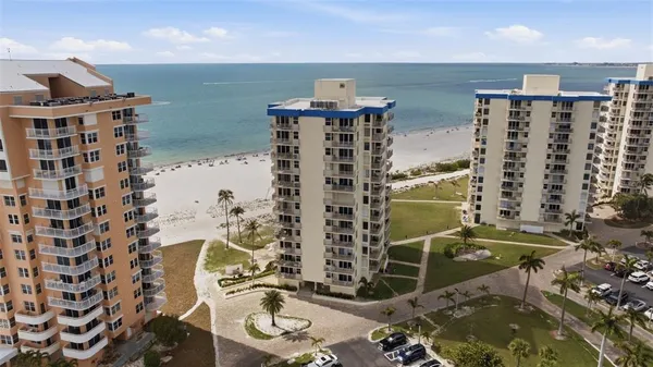 a view of ocean with a multi story building