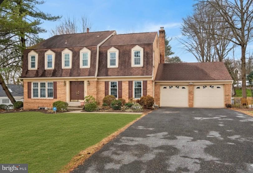 15200 Winstead Lane Silver Spring, MD 20905 - Photo 1 of 53 a front view of a house with a yard and garage