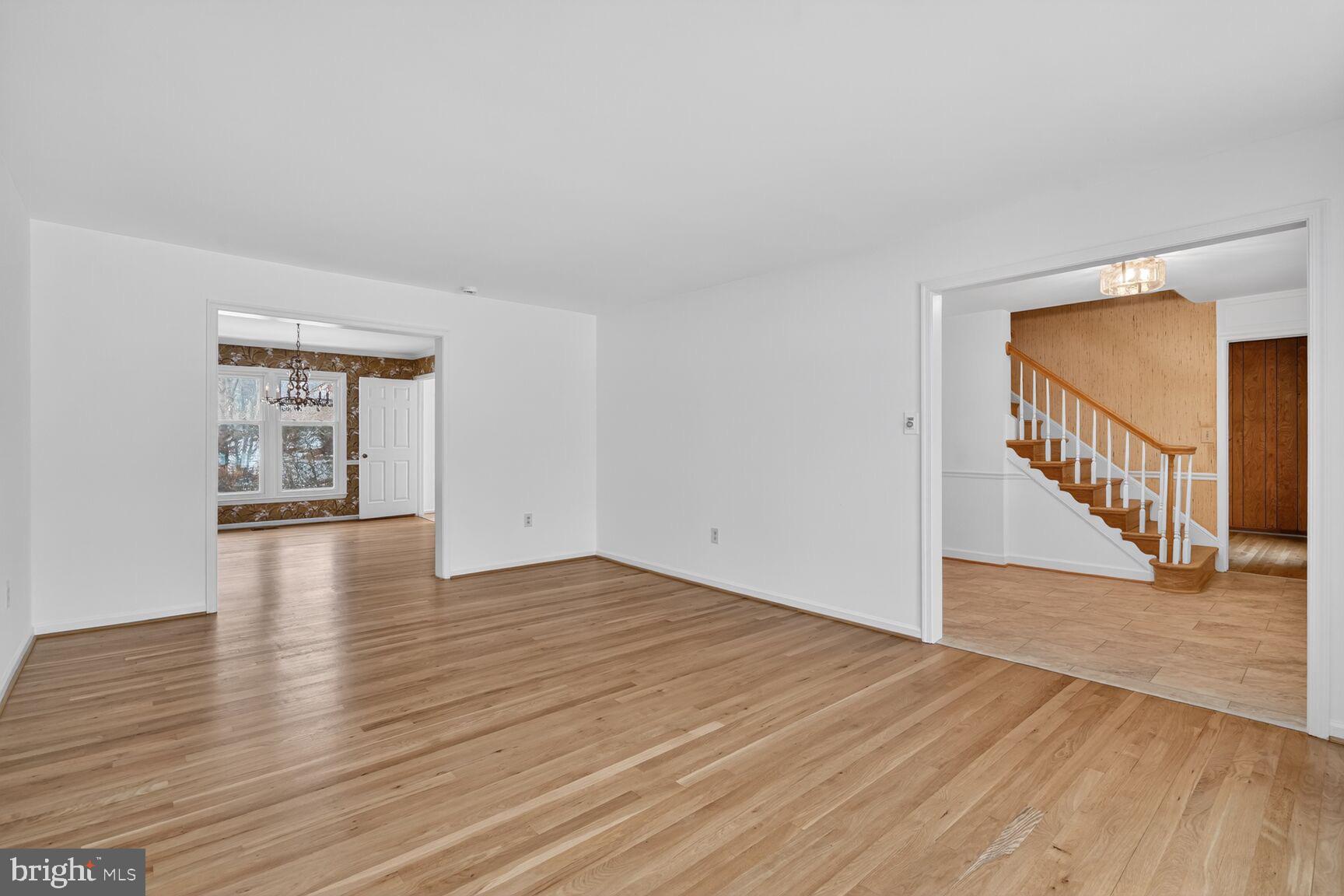 15200 Winstead Lane Silver Spring, MD 20905 - Photo 14 of 53 a view of an empty room with wooden floor and a window