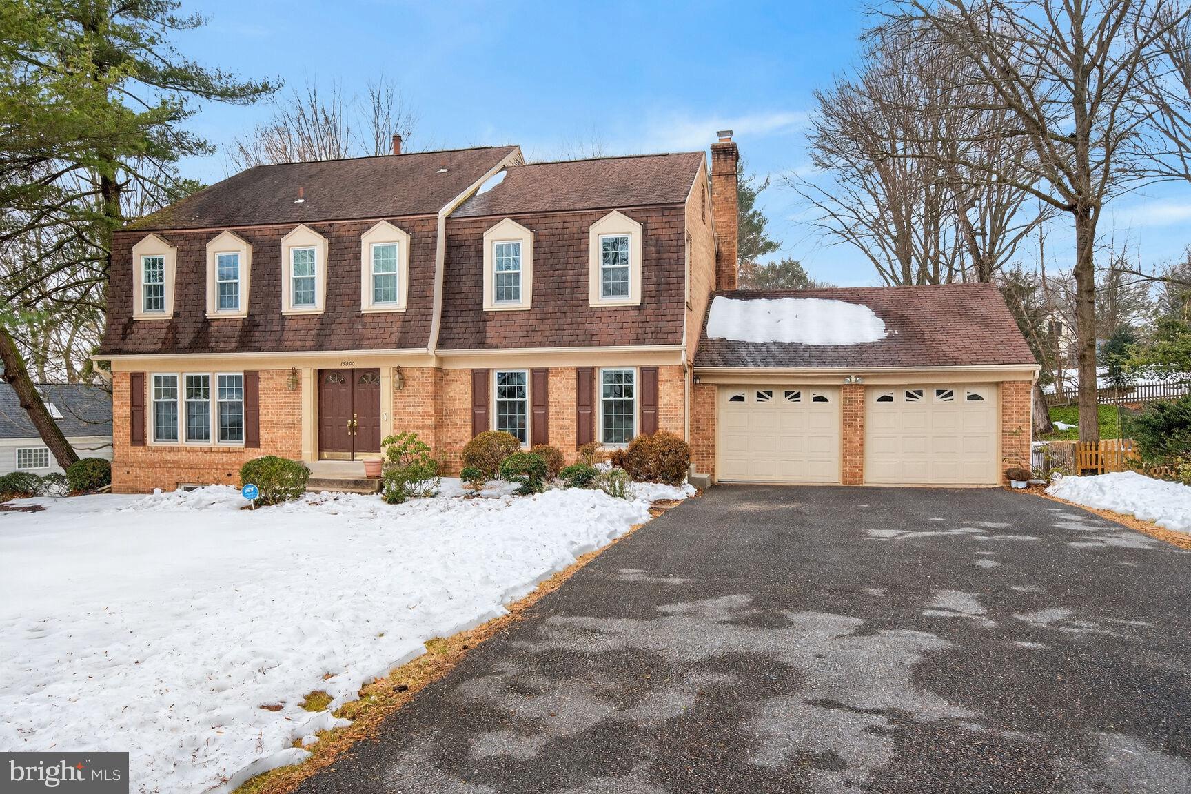 15200 Winstead Lane Silver Spring, MD 20905 - Photo 2 of 53 a front view of a house with a yard and garage