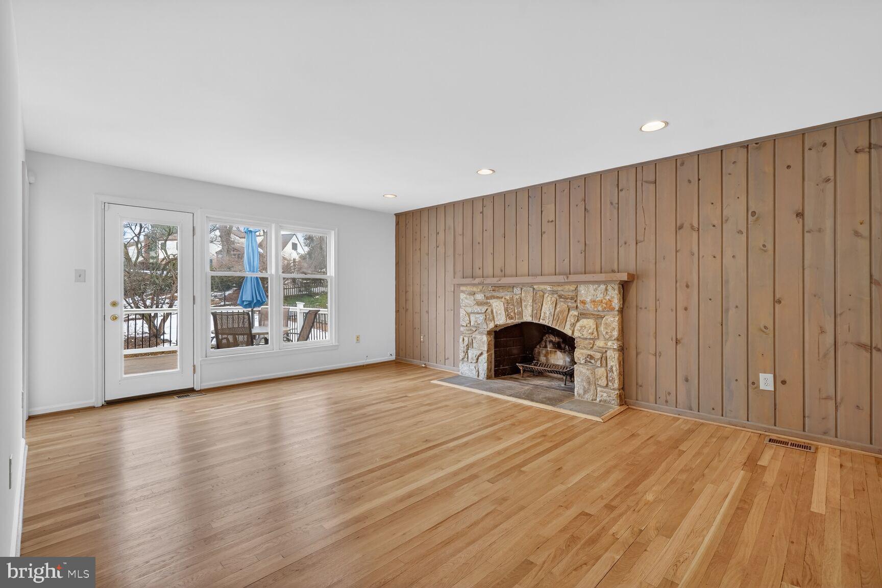 15200 Winstead Lane Silver Spring, MD 20905 - Photo 26 of 53 a view of an empty room with a fireplace and a window