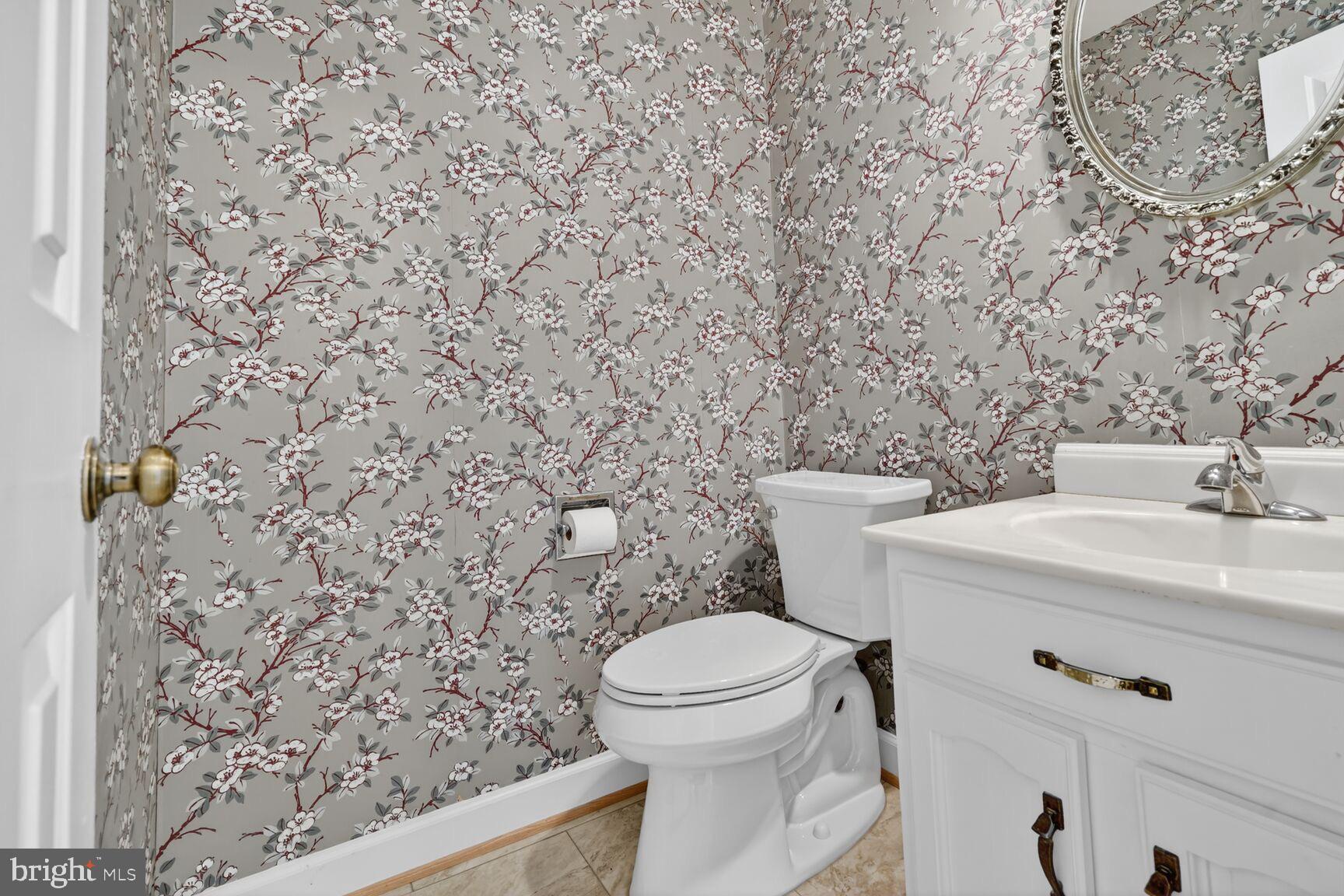 15200 Winstead Lane Silver Spring, MD 20905 - Photo 30 of 53 a bathroom with a toilet and a sink
