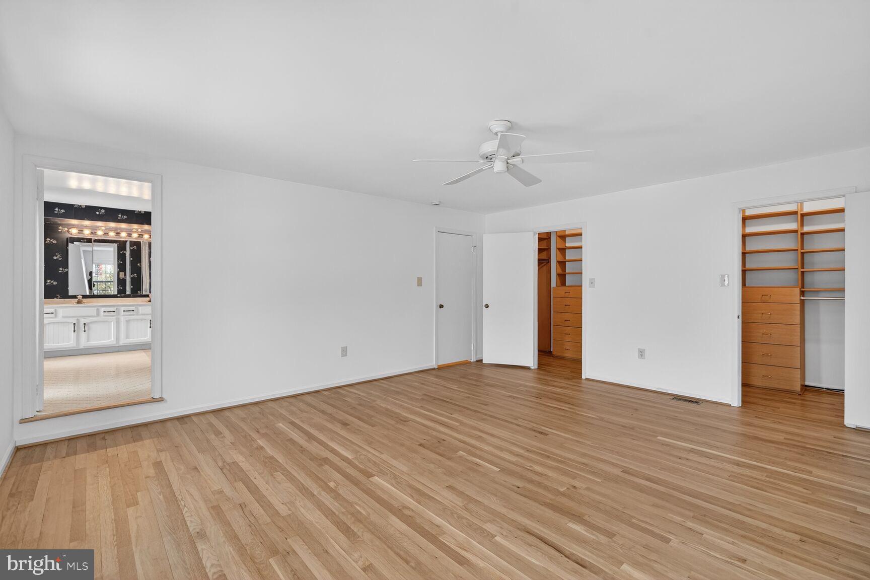 15200 Winstead Lane Silver Spring, MD 20905 - Photo 31 of 53 a view of an empty room with wooden floor and window