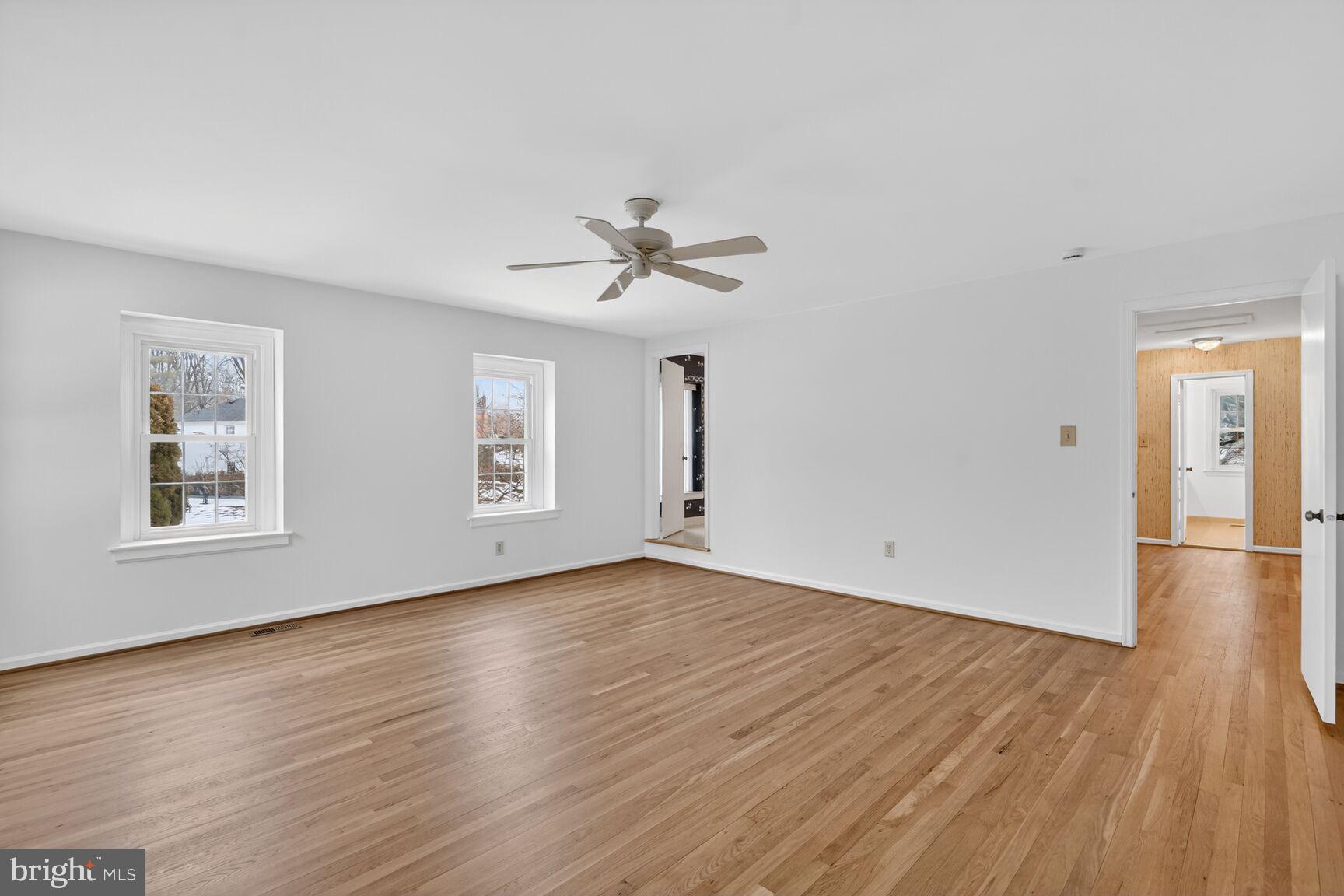 15200 Winstead Lane Silver Spring, MD 20905 - Photo 32 of 53 an empty room with wooden floor and windows