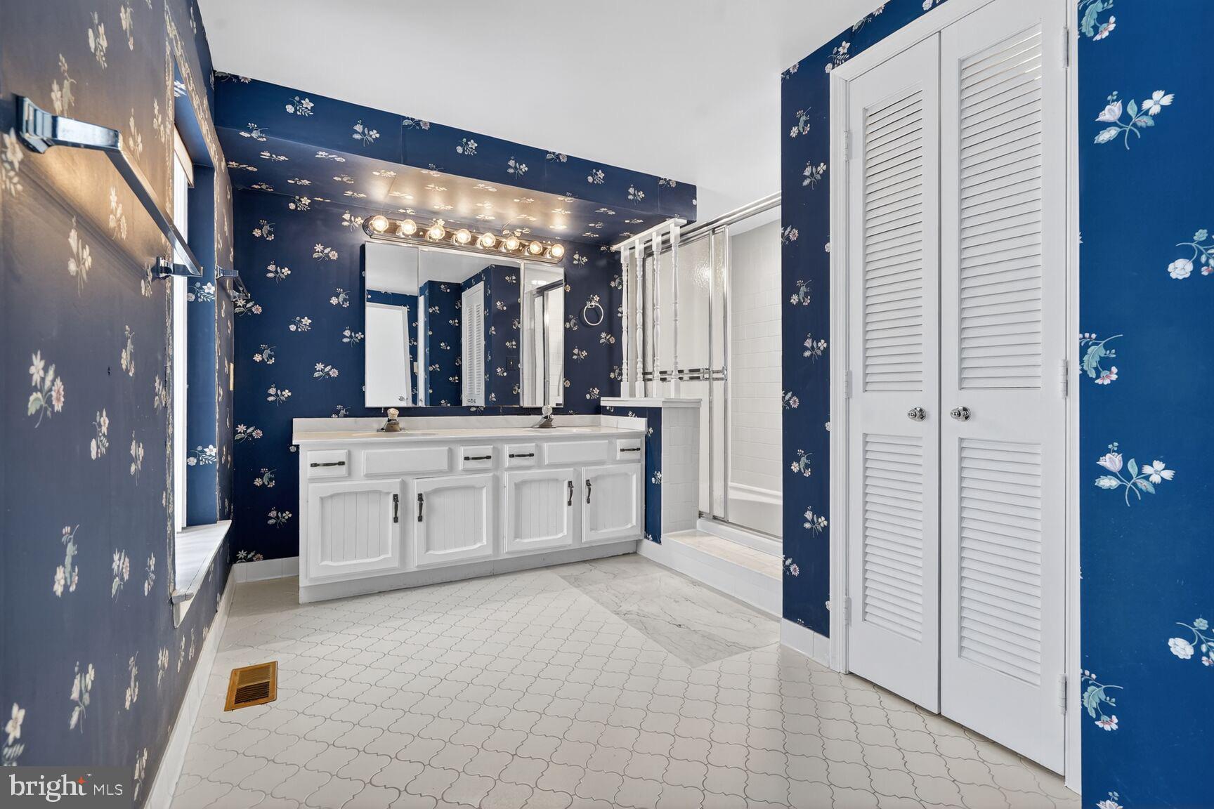15200 Winstead Lane Silver Spring, MD 20905 - Photo 35 of 53 a bathroom with a sink vanity and a mirror