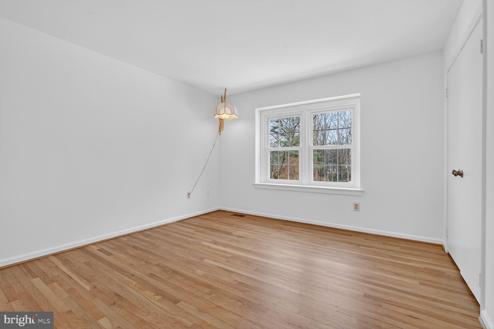 15200 Winstead Lane Silver Spring, MD 20905 - Photo 37 of 53 wooden floor in an empty room with a window