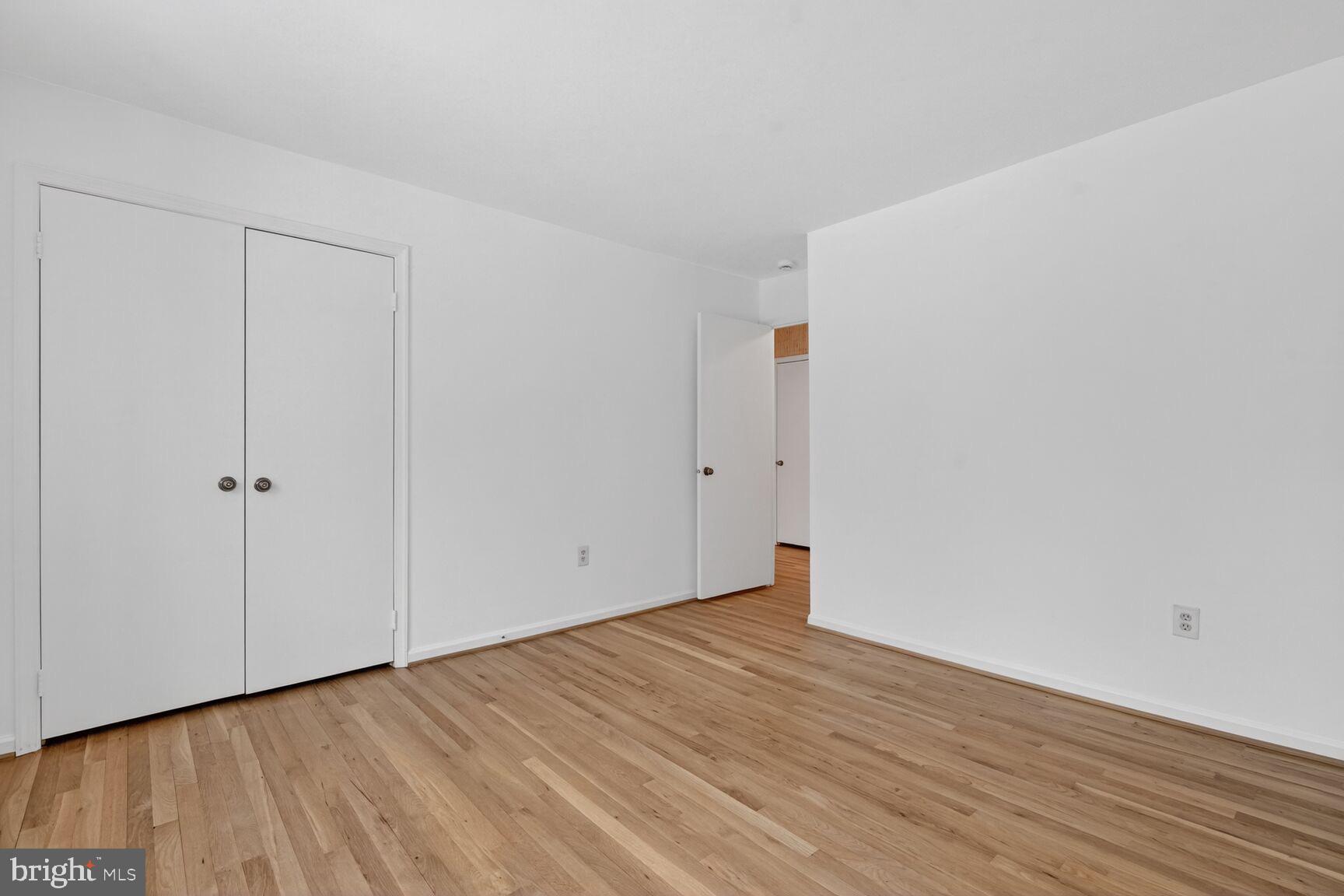 15200 Winstead Lane Silver Spring, MD 20905 - Photo 38 of 53 a view of an empty room with wooden floor