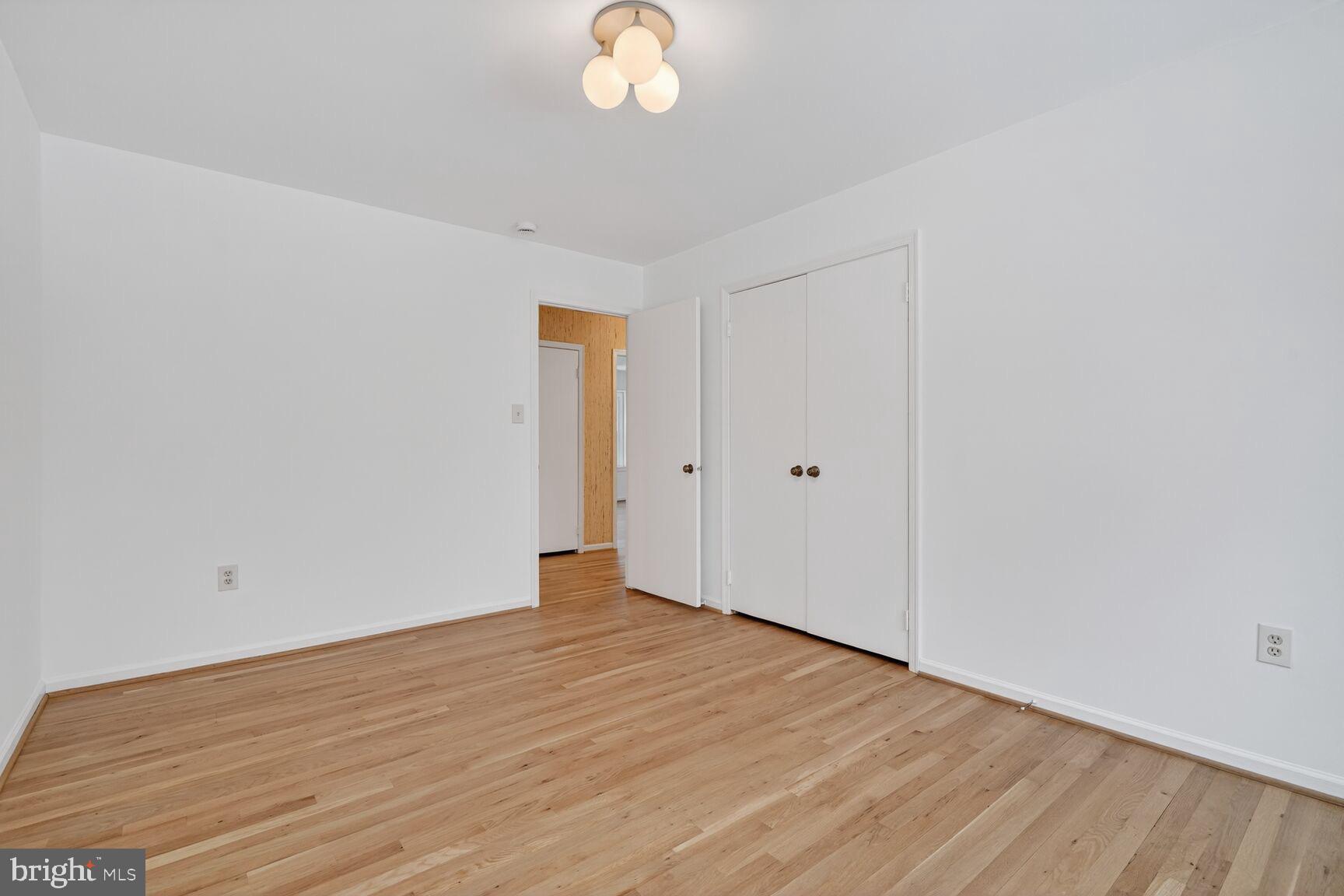 15200 Winstead Lane Silver Spring, MD 20905 - Photo 40 of 53 a view of an empty room with wooden floor