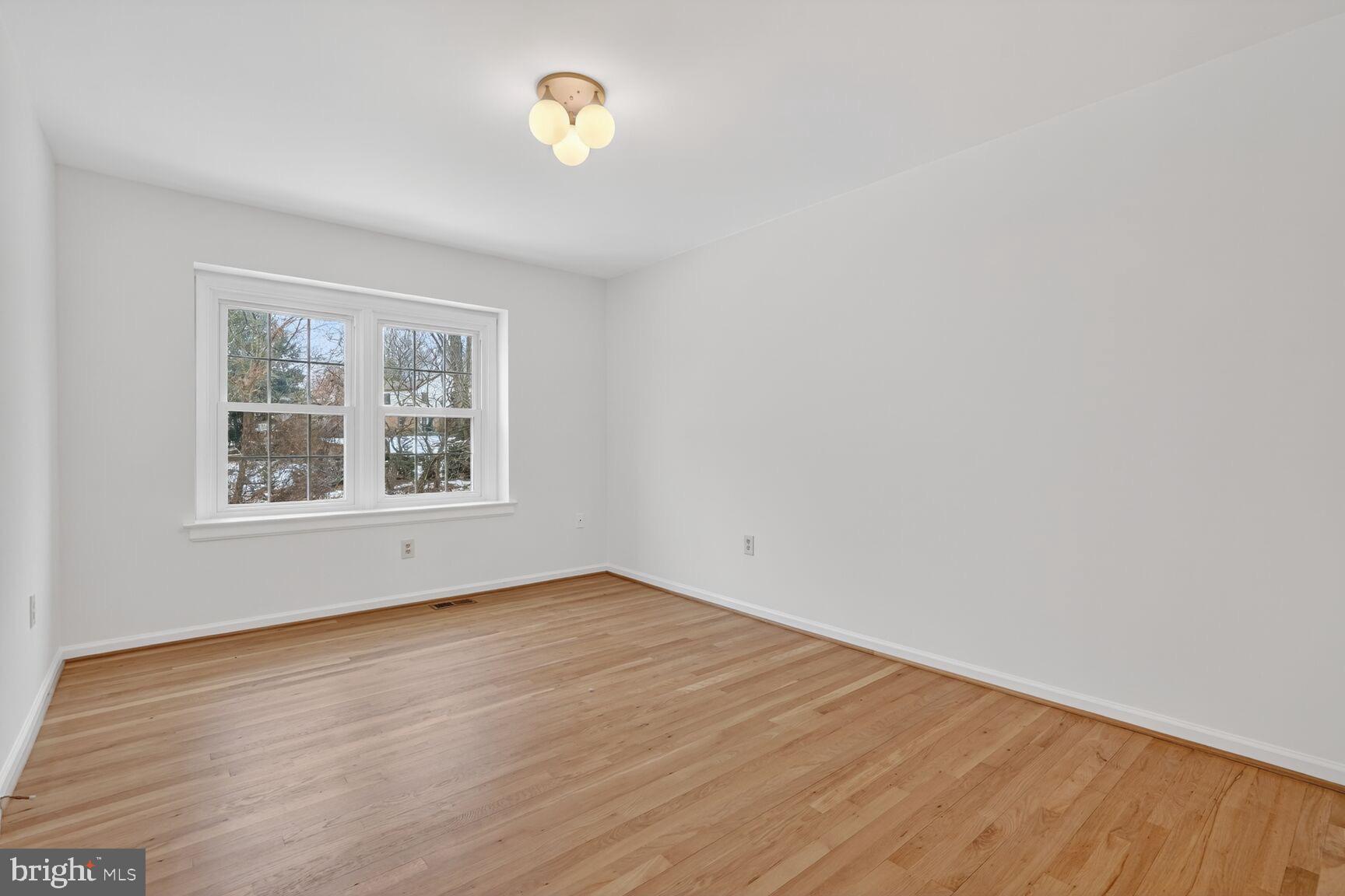 15200 Winstead Lane Silver Spring, MD 20905 - Photo 42 of 53 wooden floor in an empty room with a window