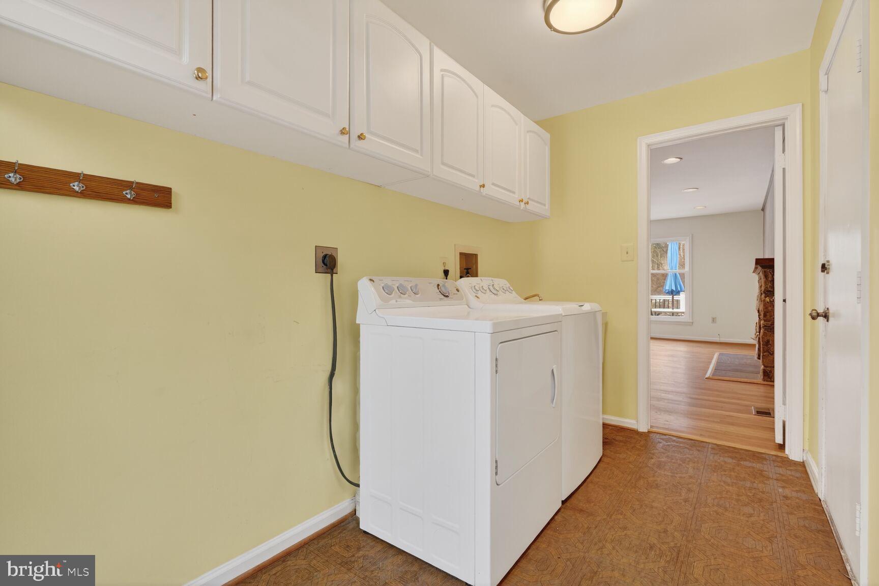 15200 Winstead Lane Silver Spring, MD 20905 - Photo 50 of 53 a utility room with dryer and washer
