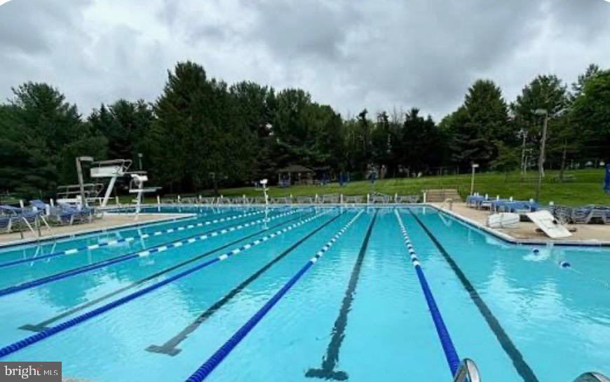 15200 Winstead Lane Silver Spring, MD 20905 - Photo 51 of 53 a view of swimming pool with a patio and a yard