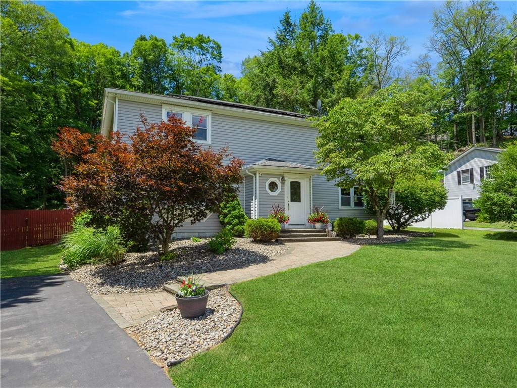101 Sutton Park Road Poughkeepsie, NY 12603 - Photo 1 of 1 a front view of a house with garden
