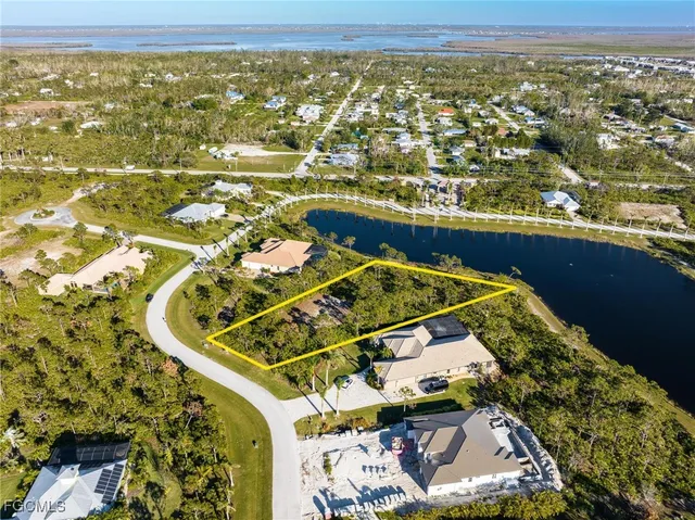 an aerial view of a residential houses with outdoor space