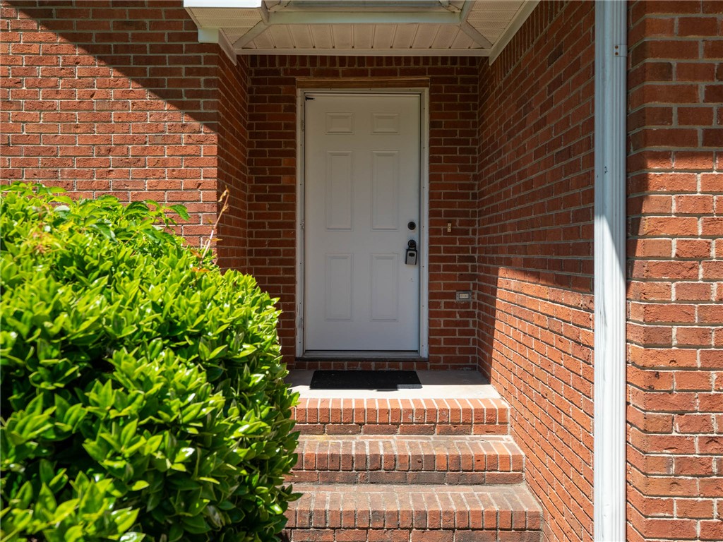 101 Woodbridge Circle Anderson, SC 29621 - Photo 3 of 21 A classic brick exterior offers a welcoming entry with a prominent white door.