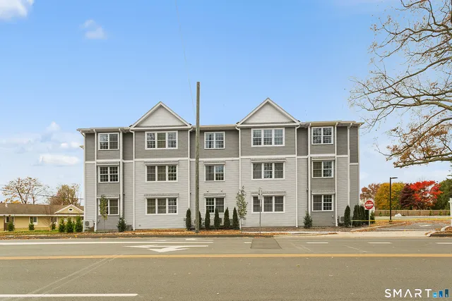 a front view of a building and a street