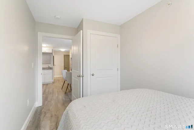 a bedroom with a bed and a bathroom