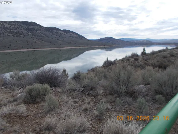 a view of a lake with mountains in the background