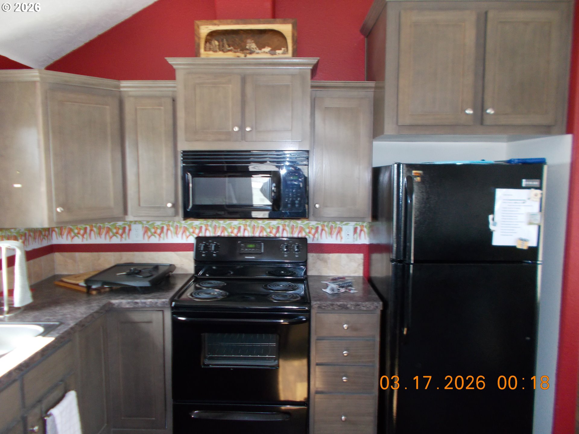 31841 Rice Road Unity, OR 97884 - Photo 15 of 26 a kitchen with a stove and a refrigerator