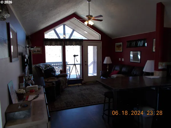 a living room with furniture lamps and a fireplace