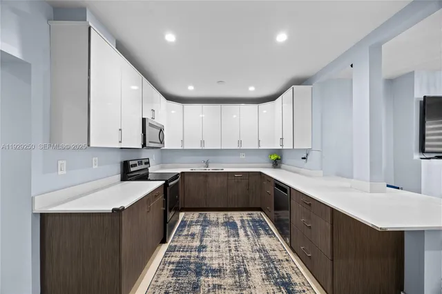 a kitchen with a sink and cabinets