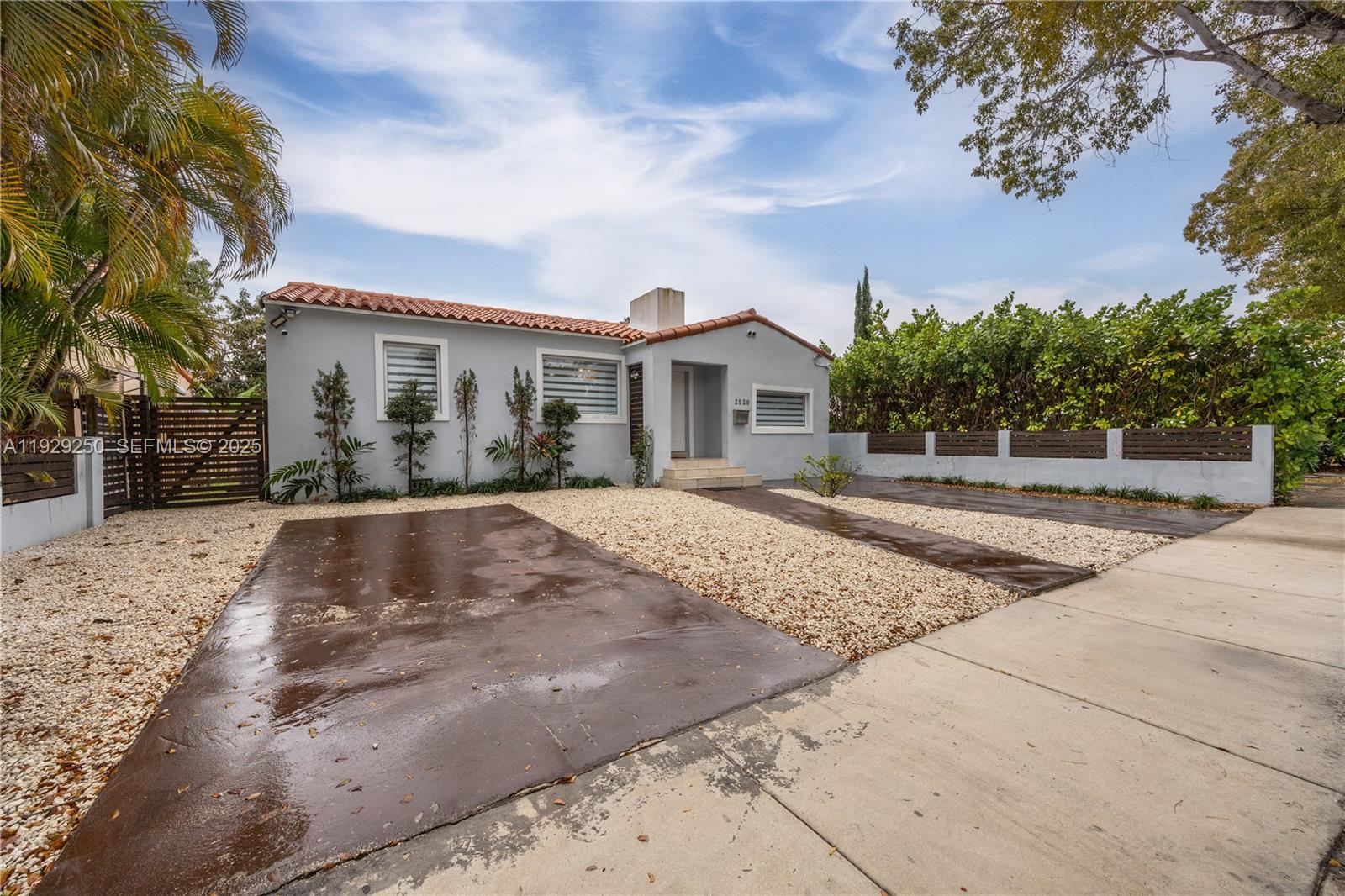 2520 Southwest 13th Street Miami, FL 33145 - Photo 2 of 26 a view of a white house with a yard