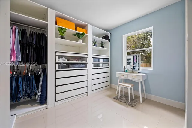 a view of room with furniture and windows