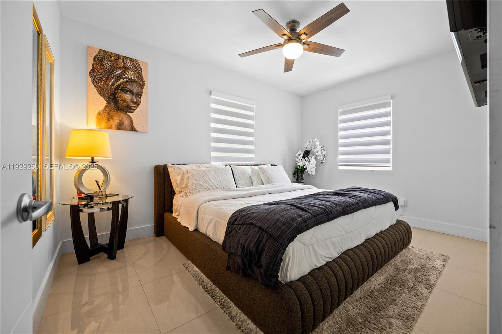 2520 Southwest 13th Street Miami, FL 33145 - Photo 23 of 26 a bedroom with a bed and a chandelier