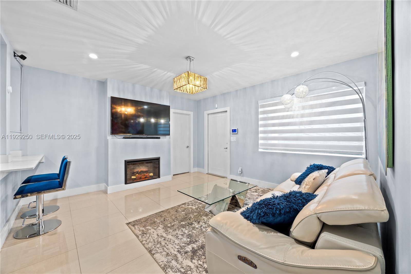 2520 Southwest 13th Street Miami, FL 33145 - Photo 24 of 26 a living room with furniture and a fireplace