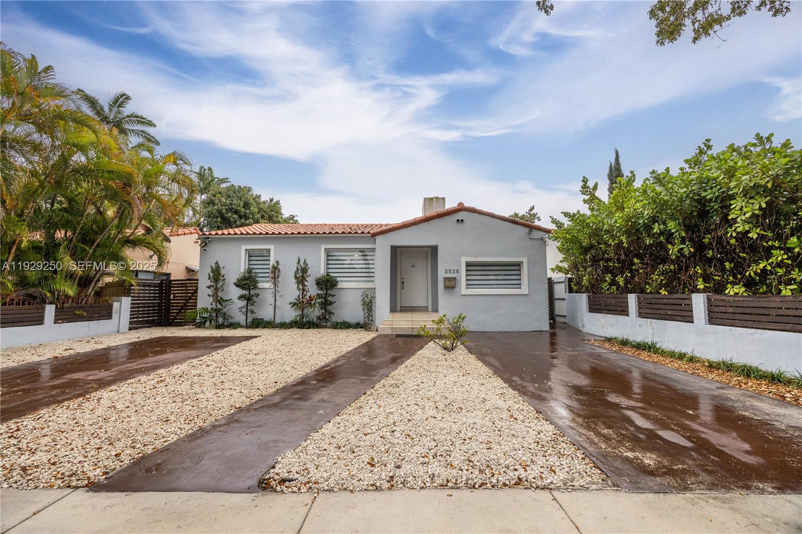 2520 Southwest 13th Street Miami, FL 33145 - Photo 5 of 26 front view of a house with a yard
