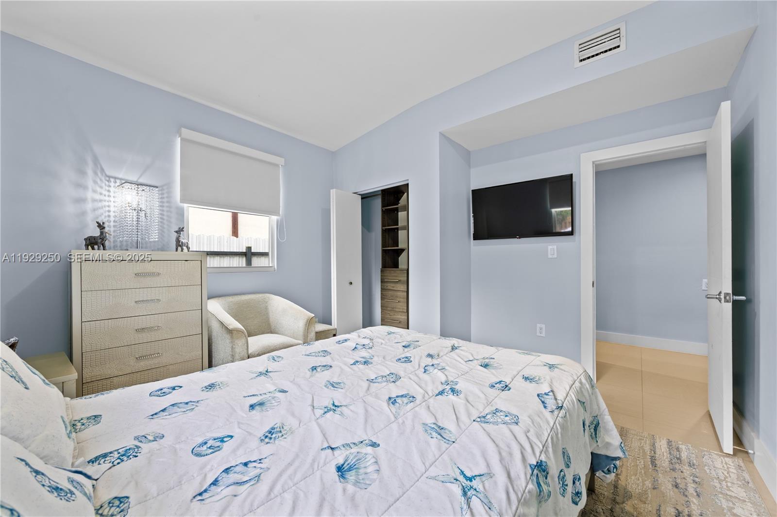 2520 Southwest 13th Street Miami, FL 33145 - Photo 8 of 26 a bedroom with a bed and a flat screen tv