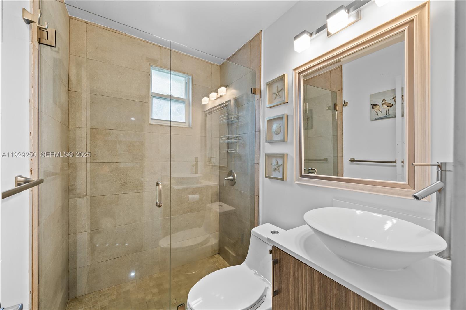 2520 Southwest 13th Street Miami, FL 33145 - Photo 9 of 26 a bathroom with a sink a toilet and shower