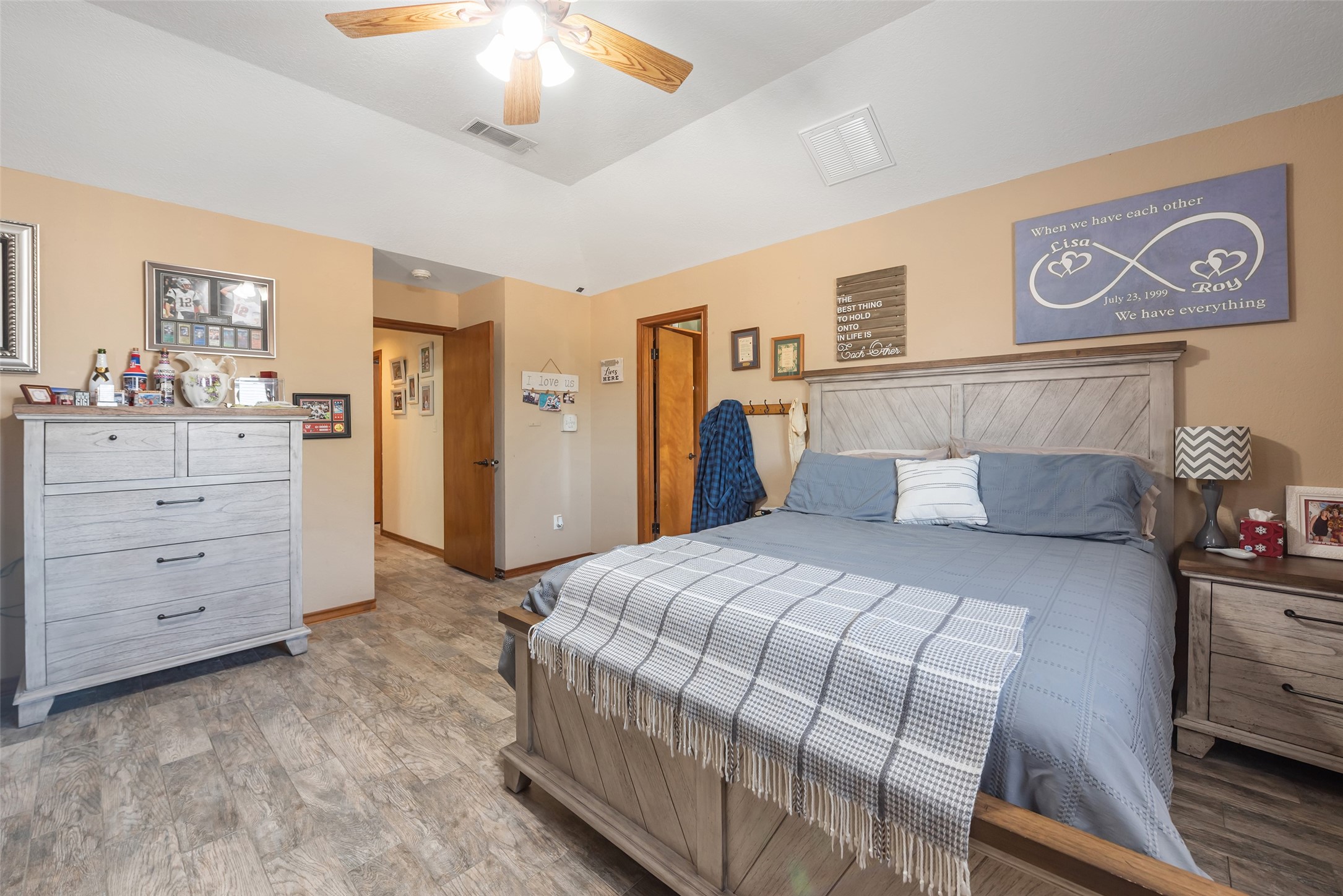 1014 Ginger Street Santa Fe, TX 77517 - Photo 18 of 50 a bedroom with a bed and a chandelier