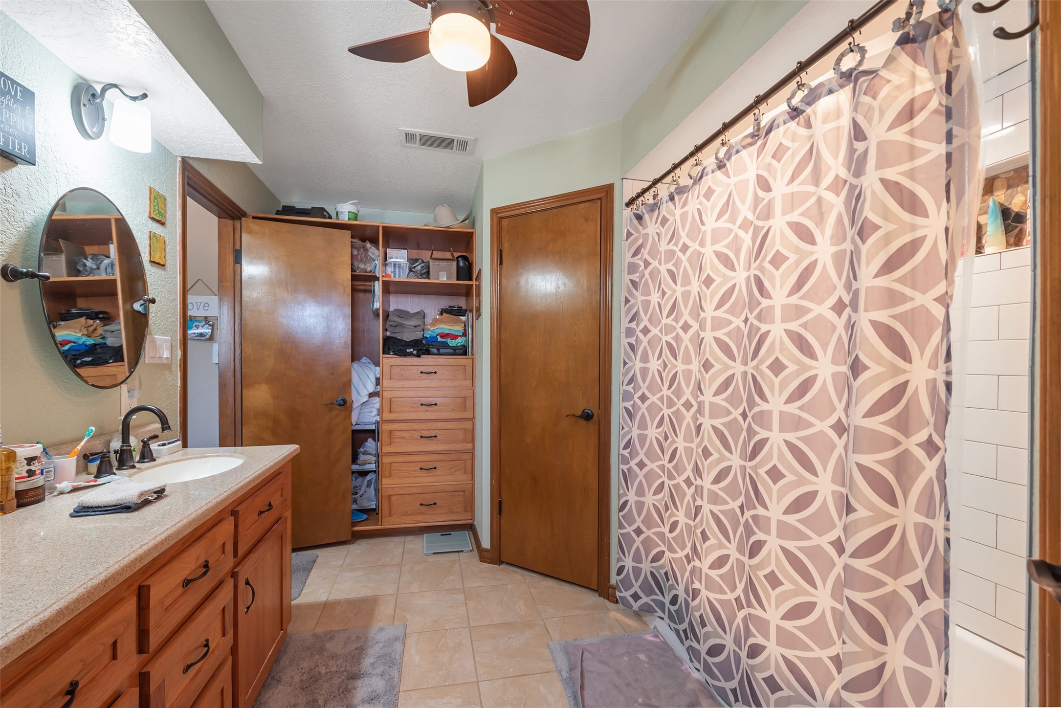 1014 Ginger Street Santa Fe, TX 77517 - Photo 20 of 50 a bathroom with a sink and a mirror
