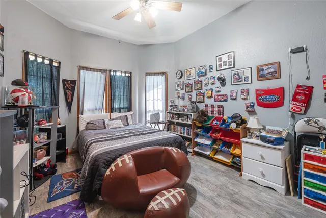 a bed room with a bed and a book shelf