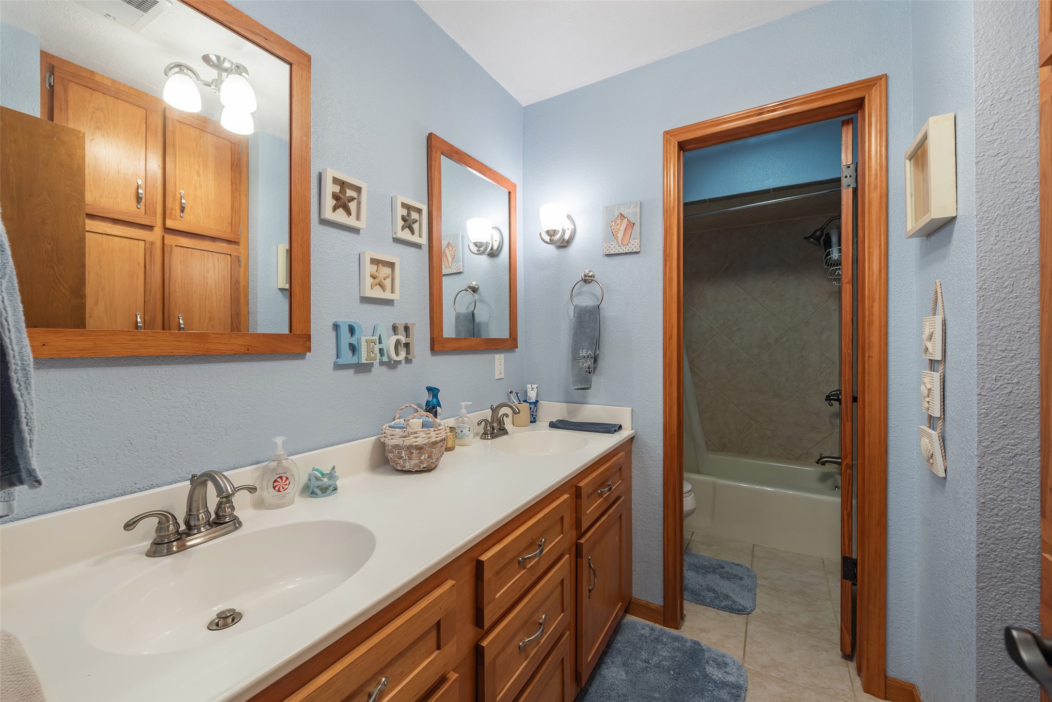 1014 Ginger Street Santa Fe, TX 77517 - Photo 22 of 50 a bathroom with a sink and a mirror