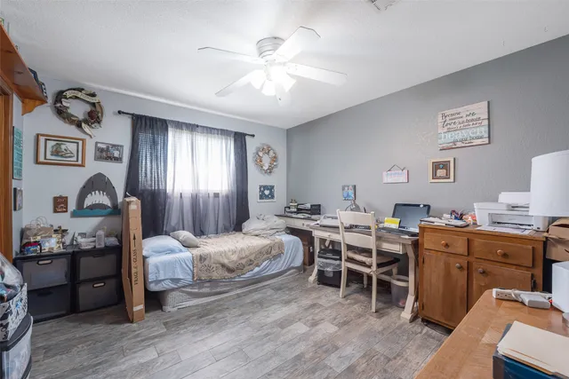 a view of a workspace with furniture and bedroom