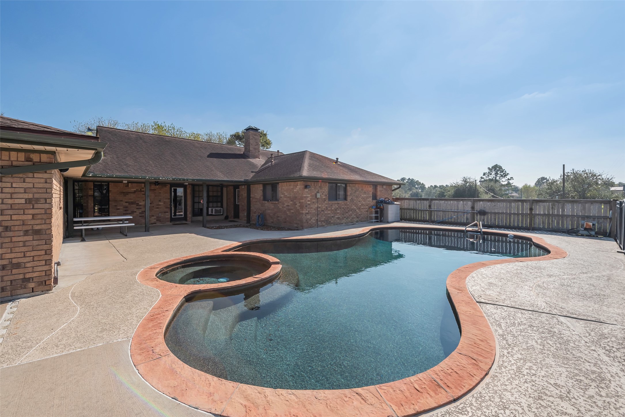 1014 Ginger Street Santa Fe, TX 77517 - Photo 26 of 50 a view of a swimming pool with a lounge chair