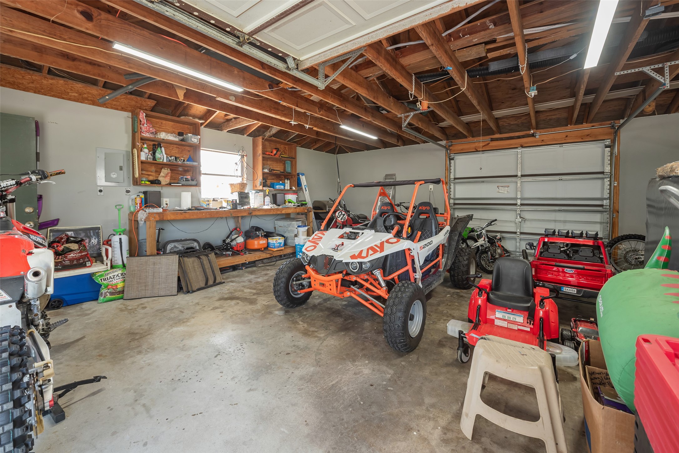 1014 Ginger Street Santa Fe, TX 77517 - Photo 31 of 50 a view of a garage with storage