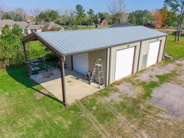 an aerial view of a house having yard