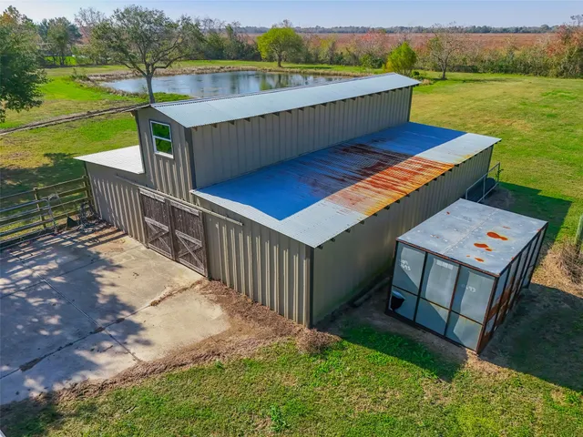 a view of a backyard with swimming pool