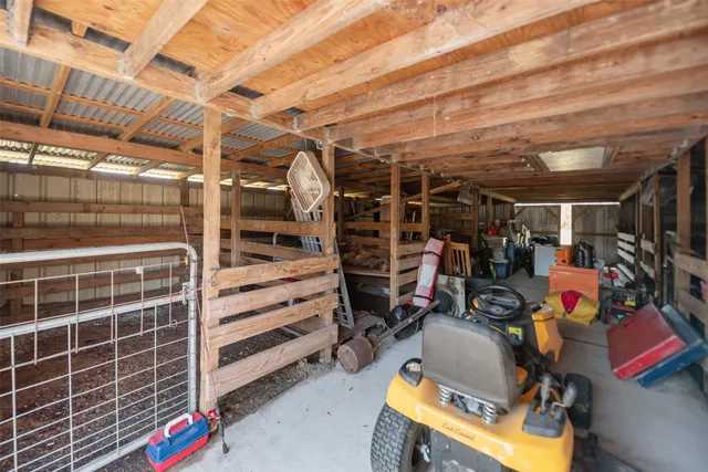 a view of an empty room with wooden walls