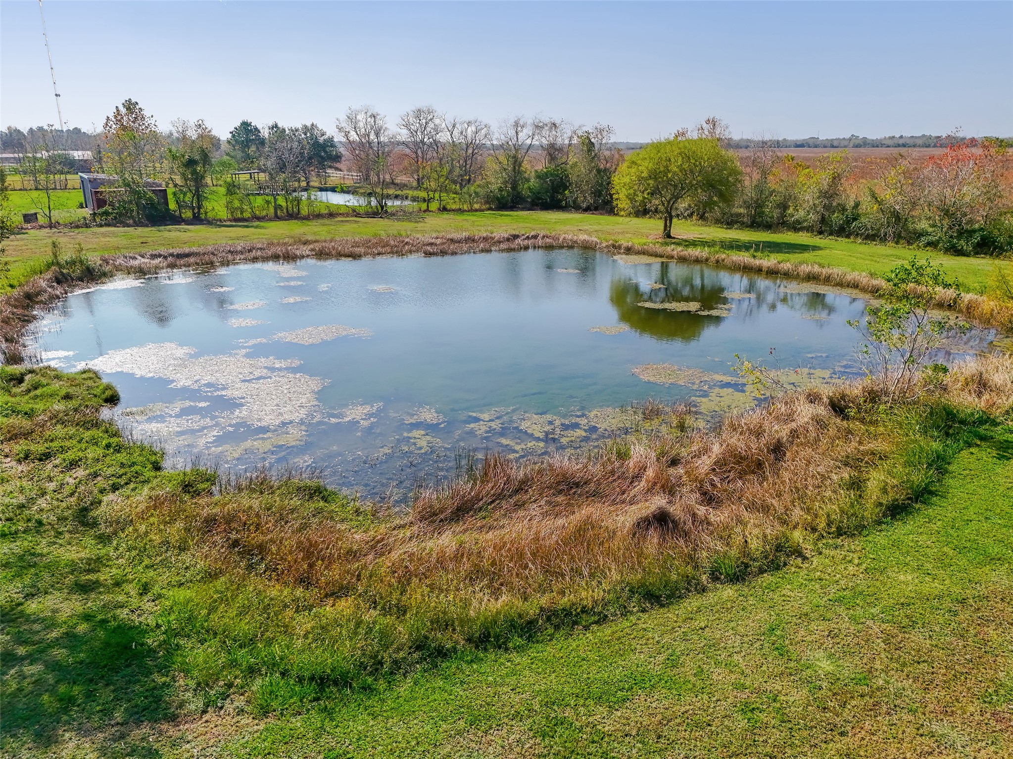1014 Ginger Street Santa Fe, TX 77517 - Photo 46 of 50 an aerial view of a houses with outdoor space and lake view
